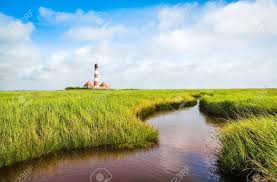 Nationalparks und naturschutzgebiete bieten schutz für die heimische tierwelt und erholung für die menschen. Schone Landschaft Mit Kleinem Teich Und Leuchtturm Im Hintergrund Nordsee In Nordfriesland Schleswig Holstein Deutschland Lizenzfreie Fotos Bilder Und Stock Fotografie Image 21130125