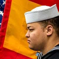 Boatswain s Mate 1st Class Larry Sherrill, aboard guided-missile frigate  USS Vandegrift (FFG 48), watches a demonstration of the bowline knot from  Leo Oates, a journeyman lineman for Clark Public Utilities.