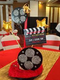 Choose plates and cutlery in colors to complement your décor. Bollywood Theme Party Table Centrepiece With Discs And Clapboard And A Touch Of Glam With Fur N Gold St Bollywood Theme Party Bollywood Theme Birthday Lights