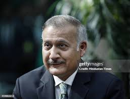 New CBI Director Anil Kumar Sinha prepares to sign a document as he... News  Photo