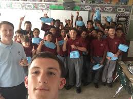 Sean-Patrick Evans '18 and Shane Dooley '19 visited with the 8th grade  class of Chuck Pavonarius '86 at St Martin Of Tours School. Notice the  banner in the background! #SalesianGentlemen #FutureCrusaders