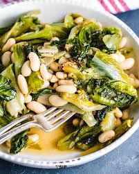 Add onion, celery, and leek and cook until slightly soft, 5 minutes. How To Make Escarole And Beans Sip And Feast