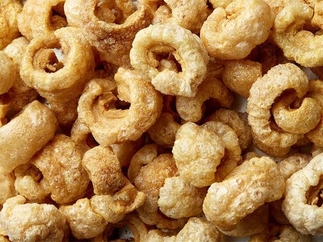 Hot-flashed pork chicharrónes boasting 79% protein, AI generated