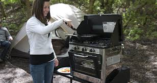 This compact camping stove features three burners and a grill top for easy cooking. Gear Of The Year Camp Chef Outdoor Oven 50 Campfires