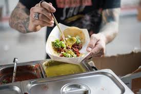 New mexico style red chile cheese enchiladas topped with two eggs, crowned with shredded lettuce, served w/ refried beans and two hot flour tortillas. New Mexican Restaurant Mi Frijoles Taco Shop Opening In New Braunfels