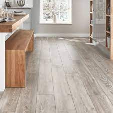 Lighter laminates can help to add a vast amount of light to a room thanks to its paler shade. Create A Contemporary Feel In Your Home With This Grey Oak Laminate Flooring Light Grey Oak Flooring Light Grey Flooring Gray Oak Floor