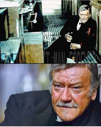 There's a moment in The Shootist (1976), John Wayne's final film, that  feels heavier than any gunfight. Wayne, as J.B. Books — the dying  gunfighter — stands at the bar, staring into