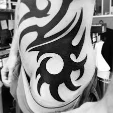 Banksy art on her side. Top 40 Best Tribal Rib Tattoos For Men Manly Ink Design Ideas