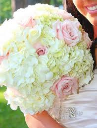 Baby blue hydrangeas and blush roses accompanied with dried palm leaves and pampas grass create a beautiful pastel look for your design. Pin On Wedding Things