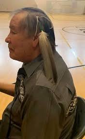 Olympic champion Billy Mills (Oglala Lakota), presented with an Eagle  Feather at Lake Andes school. The only American to ever win Olympic gold in  the 10,000 meters. Billy Mills remains the USA's