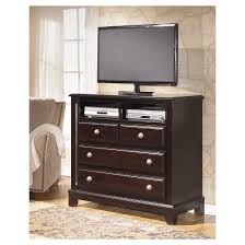 Impressing With Depth And Dimension The Ridgley Media Chest Is A Standout In Contemporary Style Elements Furniture Ashley Furniture Bedroom Ashley Furniture