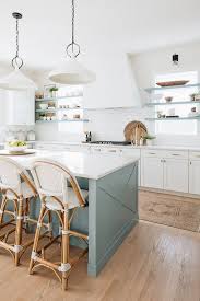 The color blue triggers feelings of relaxation, peace, quiet, grandness and expansiveness. Kitchen Blue Gray Kitchen Island Paint Color Floating Shelves Falnking Hood 2x10 White Subway T Kitchen Interior Interior Design Kitchen White Kitchen Design