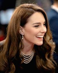 Princess of Wales and Prince William smiling