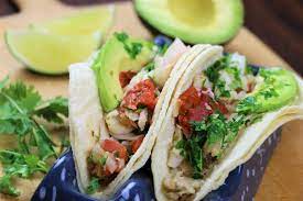 They're served in soft corn tortillas, grilled or fried with cabbage slaw, crema, and a lime to squeeze on top. Cilantro Lime Fish Tacos Saladmaster Recipes