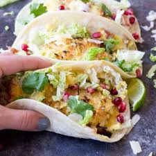 Add cumin, 1 clove garlic, zest and juice of remaining1 lemon, cucumber and process until smooth, transfer to a bowl. Crispy Fish Tacos With Pomegranate Pear And Honey Lime Crema Love Zest