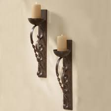 They came from the middle ages where the wall candle holders were use for lighting the hallways of the palace. Wall Sconces Candles Wrought Iron Ideas On Foter