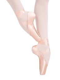 Young flexible dancer posing in pointe shoes sitting on the floor. Gallery View Selection Of Dance Shoes Dance Apparel More