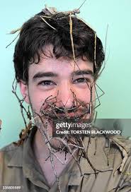 Senior invertebrate keeper Evan Armstrong, is adorned in various... News  Photo
