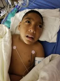 What is the cause of Landyn's abdominal distention and kidney issues?