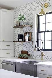 The tiles make the surface easy to clean and this idea of kitchen backsplash works best with kitchens that have open shelves rather than cabinets. Inexpensive Timeless Kitchen Backsplash Ideas Apartment Therapy
