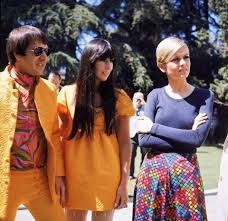 Sonny and Cher (in coordinating outfits) with Twiggy at an outdoor party in  Los Angeles, 1967.