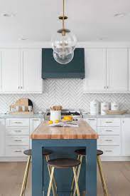 How to build a kitchen island easy diy kitchen island. Navy And White Kitchen With Butcher Block Island And White Herringbone Backsplash Interer Kuhnya Dom