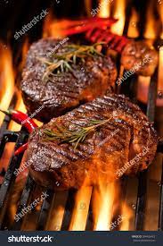 Beef Steaks On The Grill With Flames Beef Steak Steak How To Grill Steak