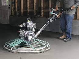 Power Trowel Finishing The Concrete In The Garage Project Small House Power Trowel Concrete Garage