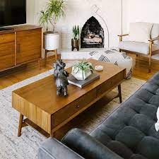 This walnut mid century modern coffee table has a fan of six slimline arched legs. Mid Century Storage Coffee Table