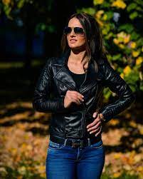 Woman In Leather Jacket And Jeans