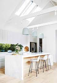Kitchen With Pitched Cathedral Ceiling And Exposed Beams A Trio Of Large Pendant Lights H White Marble Kitchen Island Marble Kitchen Island Home Decor Kitchen
