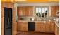 Grey Flooring With Oak Cabinets