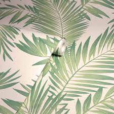 Abstract background textuer of shadows leaf on a concrete pattern with tropic summertime motif may be used as background texture, wrapping paper, textile, wallpaper design. Arthouse Tropical Palm Green Wallpaper Wilko
