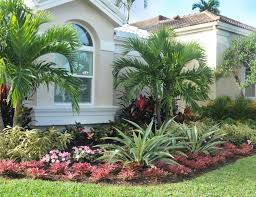 Palms And Tropical Color Form This Landscape In The Ballenisles Community In Palm Beach Gardens Florida Landscaping Backyard Landscaping Plans Landscape Plans