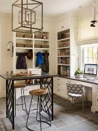 No mud room design is complete without a bench or some sort of seating to sit and remove shoes. Craft Room And Mudroom Combo Transitional Laundry Room