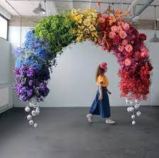 10 Mood Boosting Rainbow Wedding Ideas To Lift Your Spirits 100 Layer Cake Rainbow Wedding Theme Rainbow Wedding Flower Installation