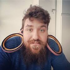 This is Oskar Klasson(Oskar Sjöstrand, @hippoear) of Mariestad, western  Sweden. His stretched lobes is only 150mm. Ok. Officially, the world record  for the largest non-surgically made ear-piercing is held by Kala Kaiwi