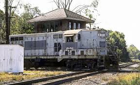 Seaboard System Or Possibly A Short Line Emd Gp7 Locomotive 631 Is Seen With A Local Freight Train While Crossing A Diamond Near Tower At Baldwin Florida 1 Train Vintage Train Railroad Photography