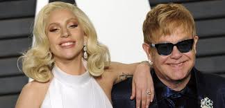 Sir elton hercules john (birth name reginald kenneth dwight, born 25 march 1947 in pinner, middlesex, england), better known simply as elton john, is an english singer, songwriter, pianist, and composer. Sir Elton John Reveals What Lady Gaga Is Like As Godmother To His Sons