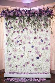 Floriculture S White Lavender Flower Wall With Large Cascading Arrangements Accented At The Top The Cosmopol Flower Wall Wedding Flower Wall My Wedding Day