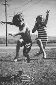 Black And White Children Playing It S Coming Photography Black And White Black And White Photography
