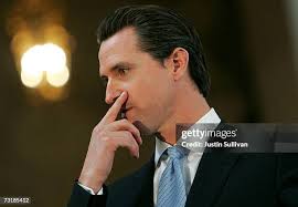 San Francisco mayor Gavin Newsom greets children at an event kicking...  News Photo