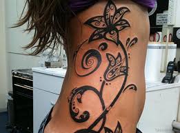 Footprint tattoo design dog ink @monami_tattooer. 54 Best Tribal Tattoos For Rib