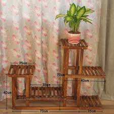 This solid wood flower stand is made of bamboo, with a stable structure and strong internal use. Wood 4 Tier Flower Pot Racks Home Garden Decor Etagere Plant Pot Display Shelf Planter Stand Flower Patio Deck In Potted Plants Patio Flower Pots Planter Stand