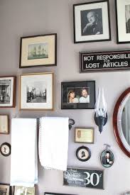 Hanging picture frames on the walls in your home is a simple diy task. My Bathroom Photo Wall Susan Branch Blog