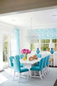 Geometric Elements Like A Striated Orb Chandelier And Angular Pedestal Base Table Convey A Stron Turquoise Dining Room Beach House Dining Room Dining Room Blue