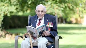 War hero captain tom moore, 99, raises £13 million* for the nhs by doing one hundred laps of his garden on a wheeled zimmer frame. Kk1c 7fzyak1gm