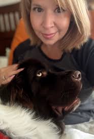 Newfoundland dog welcomes owner home with affection