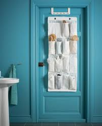 A Bathroom Door With Hanging Shoe Organizer Whose Pockets Hold Brushes Hair Sprays And Other Toiletries Shoe Organizer Ikea Ikea Bathroom Layout