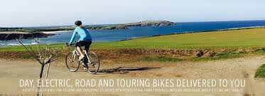 Family of cyclists on the camel trail approaching padstow. Go By Cycle Cornwall Bike Hire Delivered To Your Door